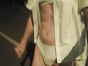 Bella does a night time lingerie walk down the street