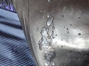 gasmask nun bessy  is riding a big dildo and is looking her own video where she is swallowing piss from a condom ,later she wank on rubberboots and lick spunk and swallow