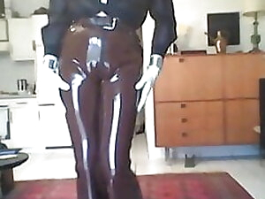 posing in brown rubber slacks